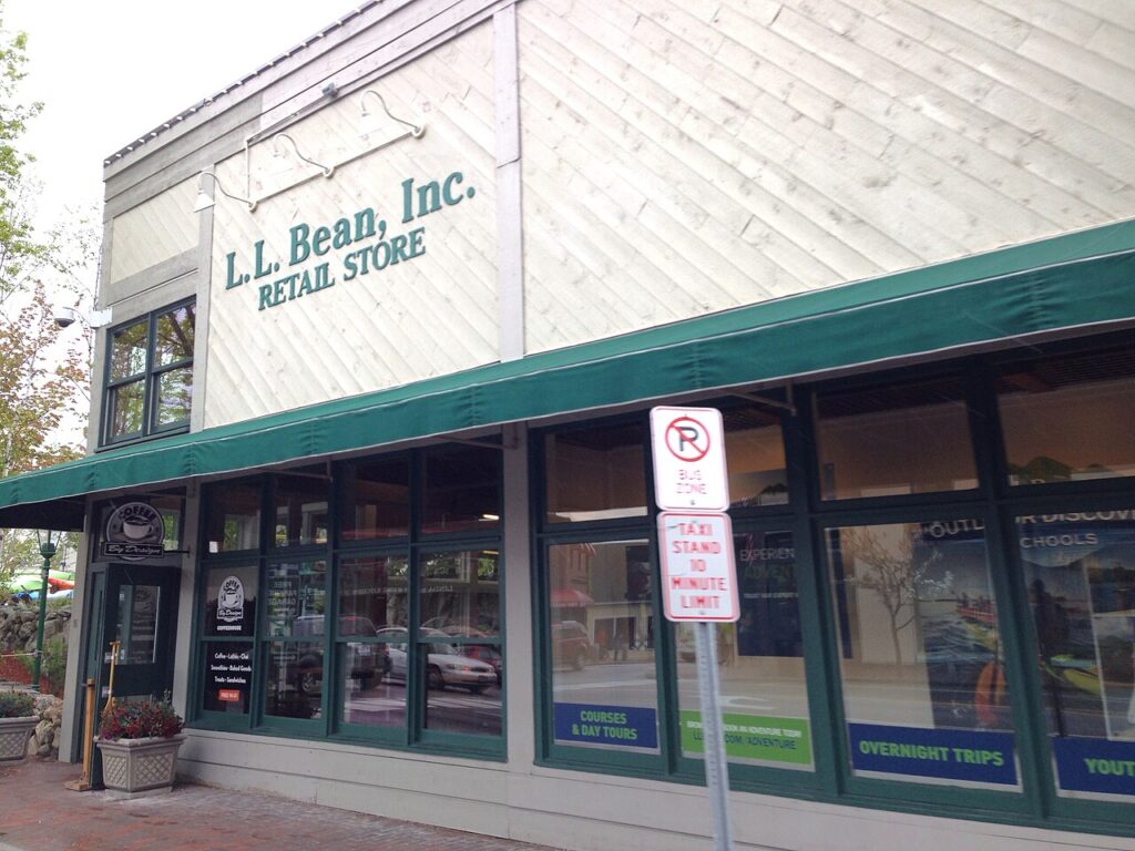 The storefront exterior and classic green awnings of the L.L. Bean retail store.