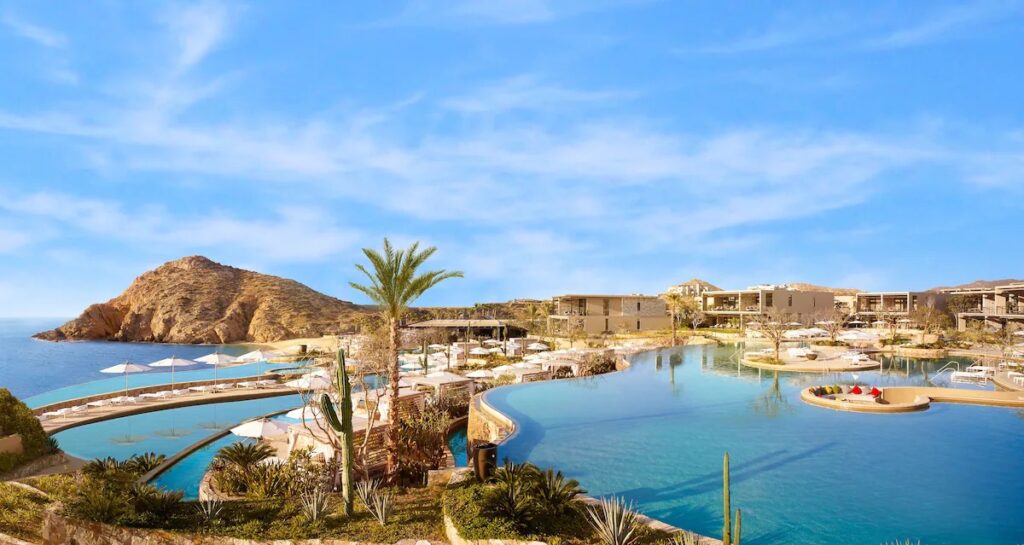 The massive winding infinity pool and swimmable beach at Montage Los Cabos, a standout among elite Mexico resorts.