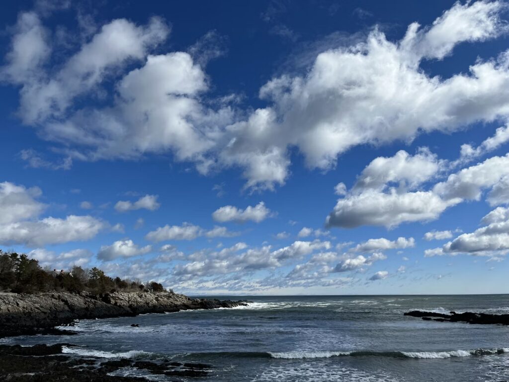 Waves crashing against the rocky pebble beaches and coastal inlets along the Marginal Way in Ogunquit, Maine.