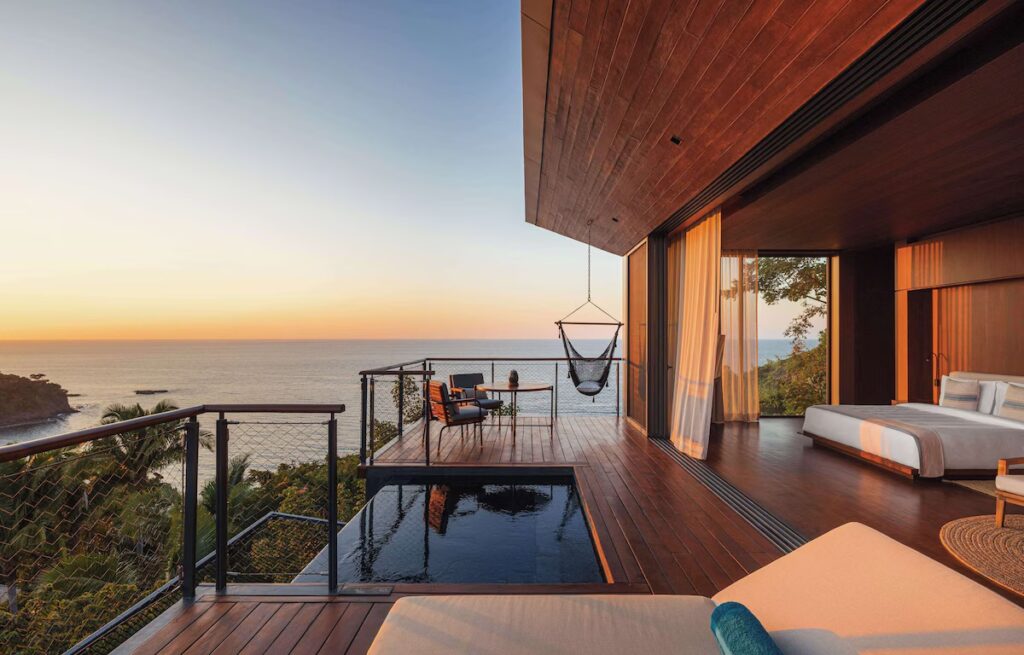 A private cliffside villa terrace with a plunge pool and hammock overlooking the ocean at One&Only Mandarina.