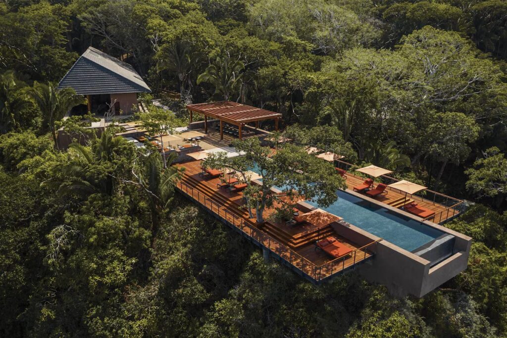 A secluded infinity pool and sun deck suspended high in the lush jungle canopy at One&Only Mandarina.