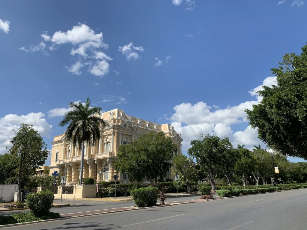 Palacio Cantón, an elegant yellow mansion located on the tree-lined Paseo de Montejo in Mérida.