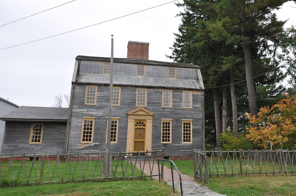 The historic, weathered wood exterior of the pre-Revolutionary Tate House Museum in Portland. 