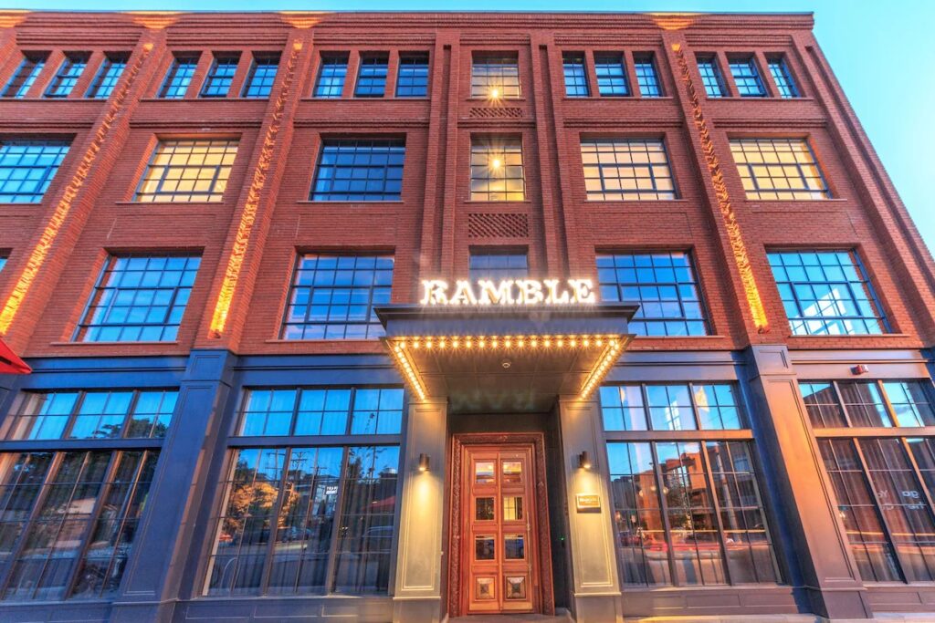 Exterior of The Ramble Hotel in Denver featuring a classic red brick facade. 