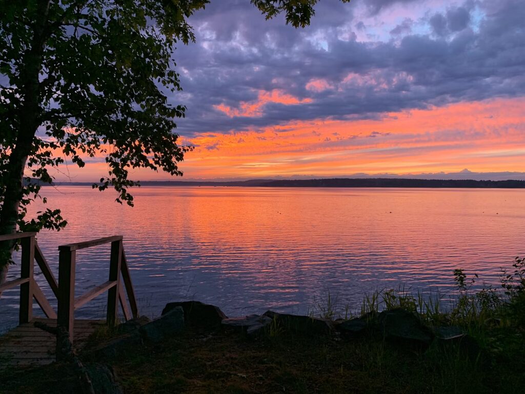 15 Best Things to Do in Bar Harbor, Maine (Acadia & Beyond) Breathtaking sunset view from a wooden dock, featuring the best things to do in Bar Harbor, Maine.