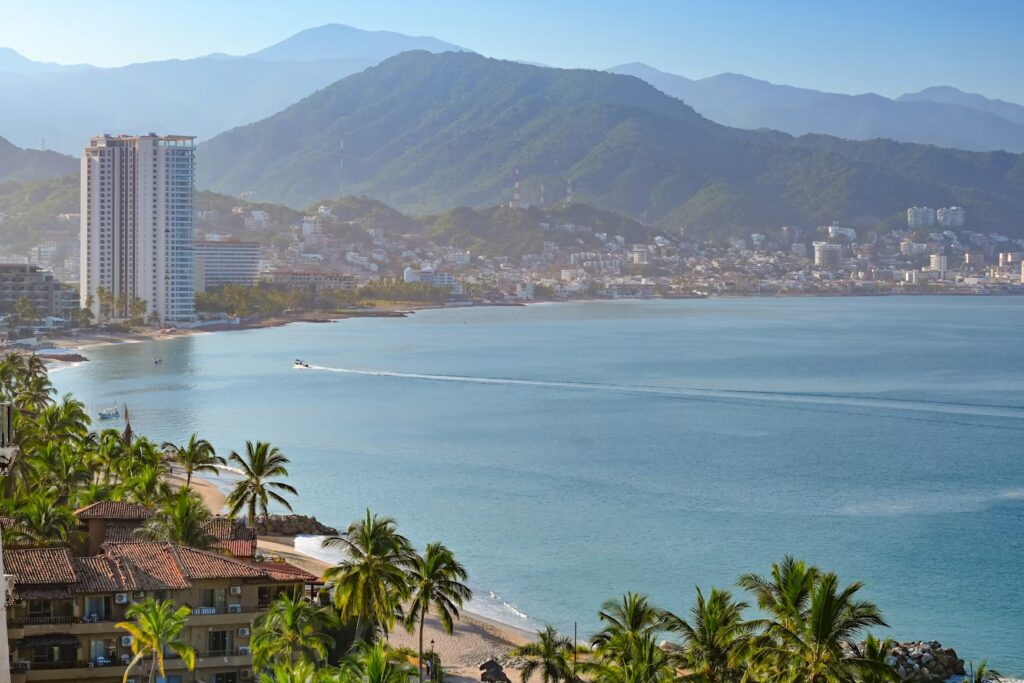 A beautiful coastal view of the beaches and high-rise resorts in Puerto Vallarta, confirming "is Puerto Vallarta safe?"