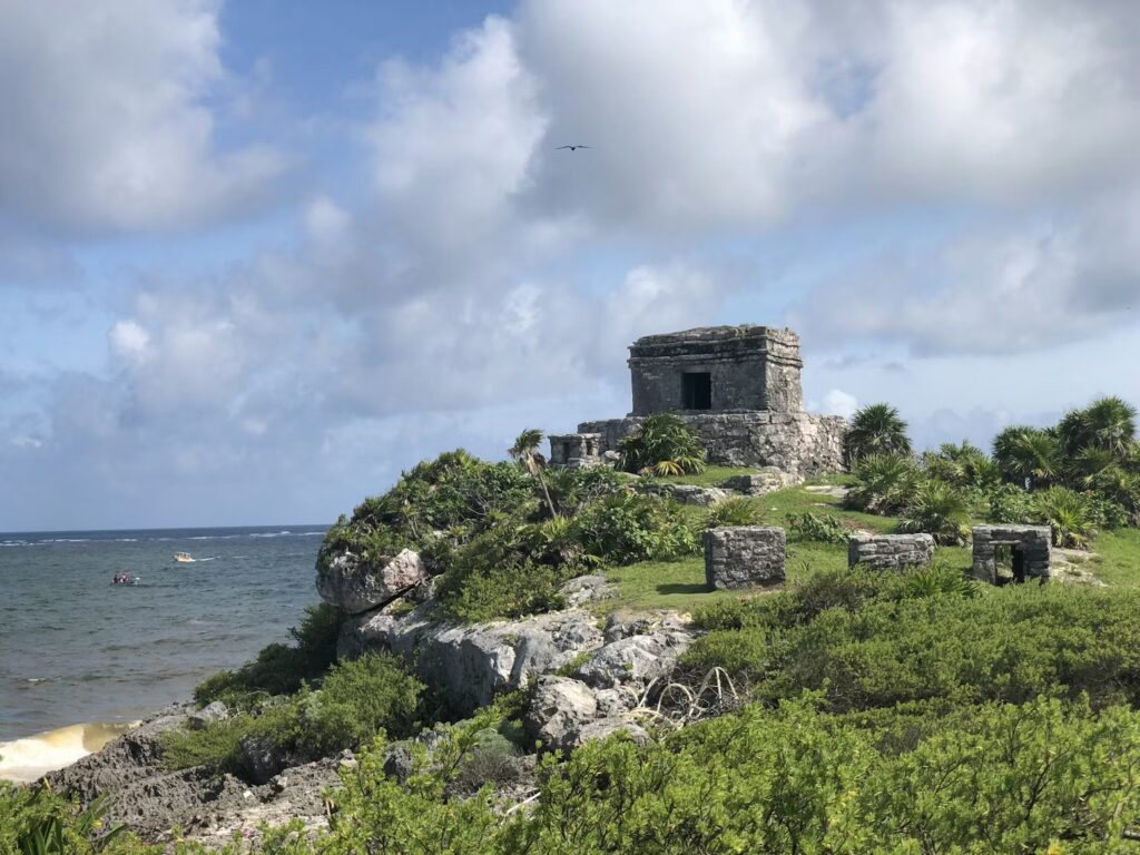 The dramatic ancient Maya ruins sitting on a cliff directly overlooking the Caribbean Sea in Tulum.
