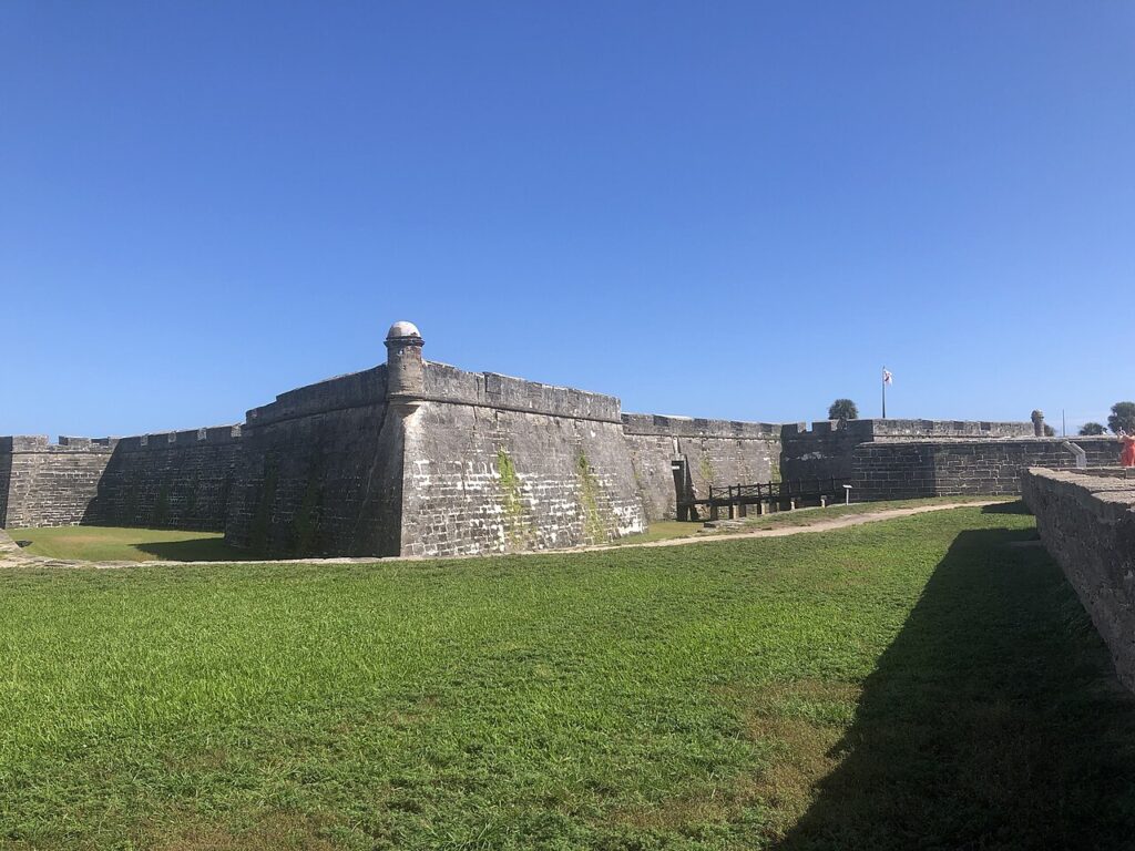 Weathered coquina stone walls and a watchtower at Castillo de San Marcos.