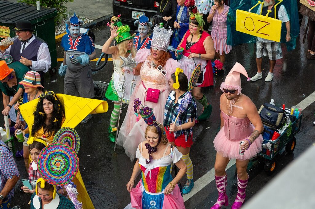 Crowds of people wearing creative and elaborate costumes during the festive Fantasy Fest parade.