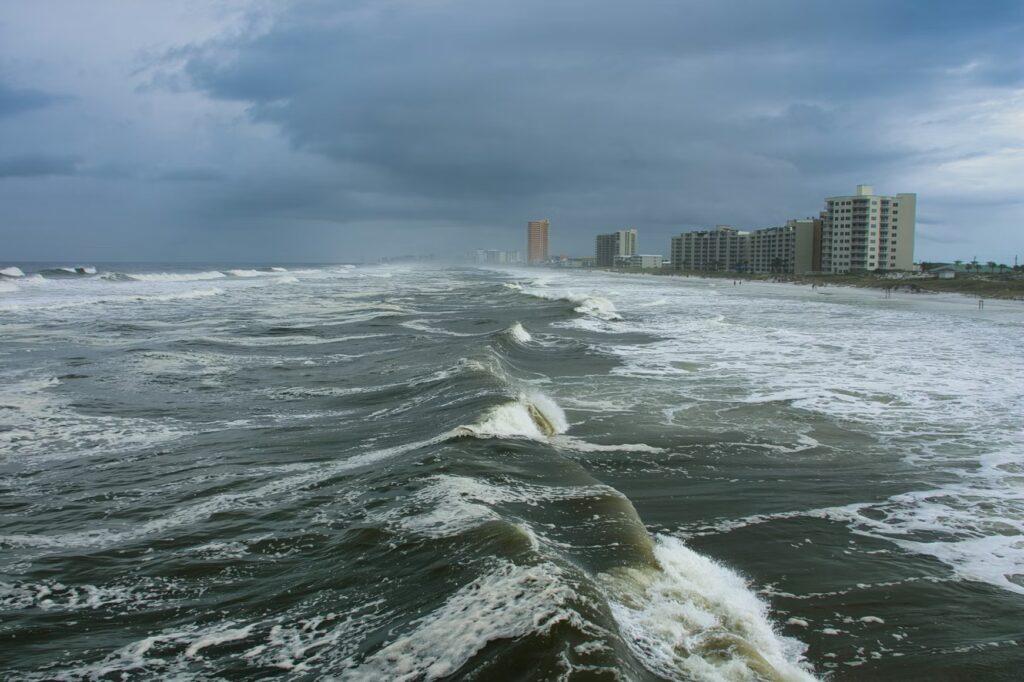 Rough, dark waves crashing against the Florida coast during the hurricane season.