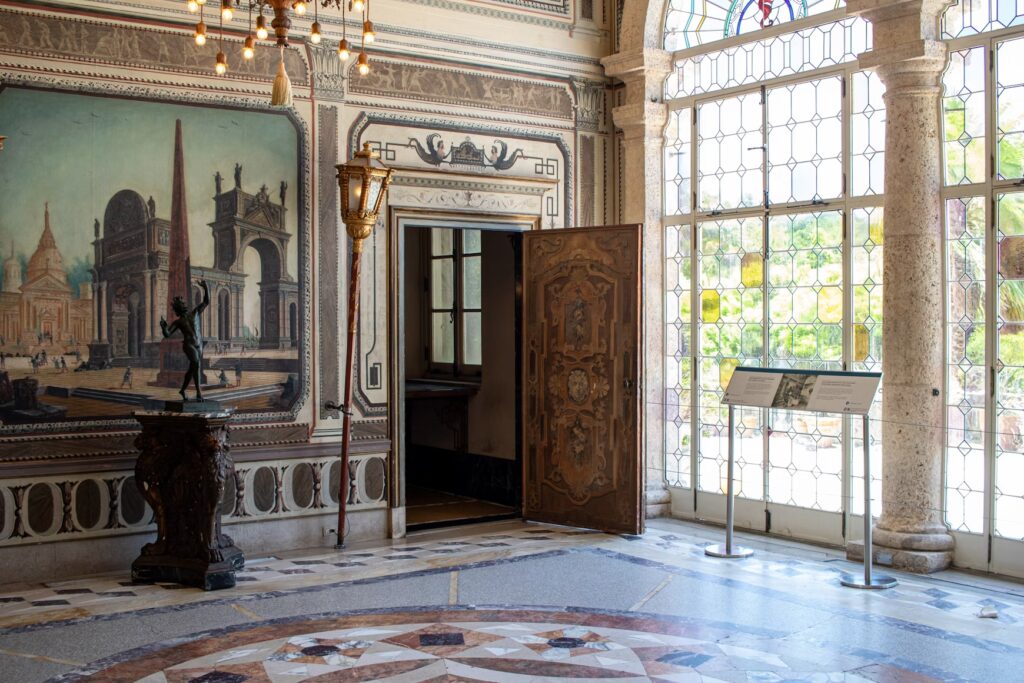 An ornate indoor room at Vizcaya featuring detailed walls and glass doors.