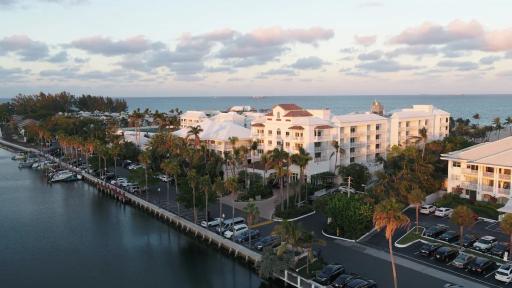 Aerial coastal resort grounds near marina at quiet gulf coast oceanfront resorts.