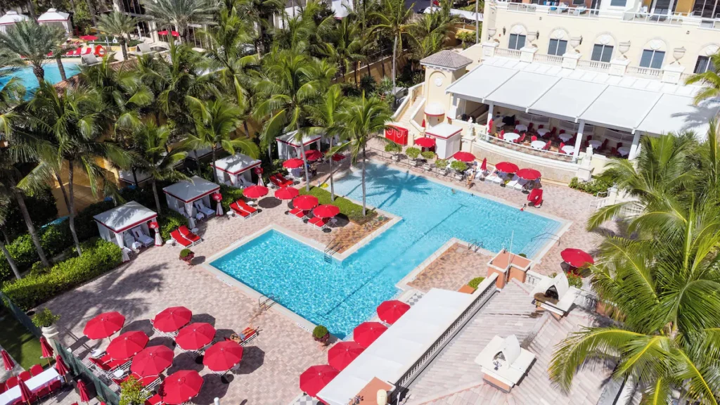 Aerial view of oceanfront swimming pools at luxury Florida beach resorts 2026.