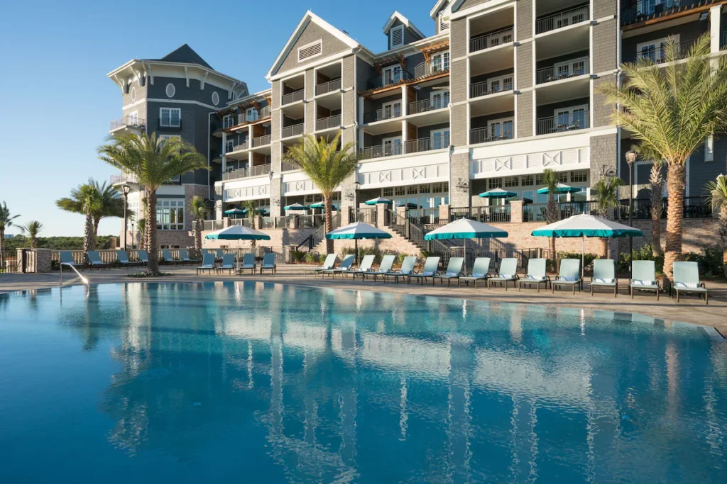 Beachfront adults only resort swimming pool along the dune line at quiet gulf coast escapes in FL.