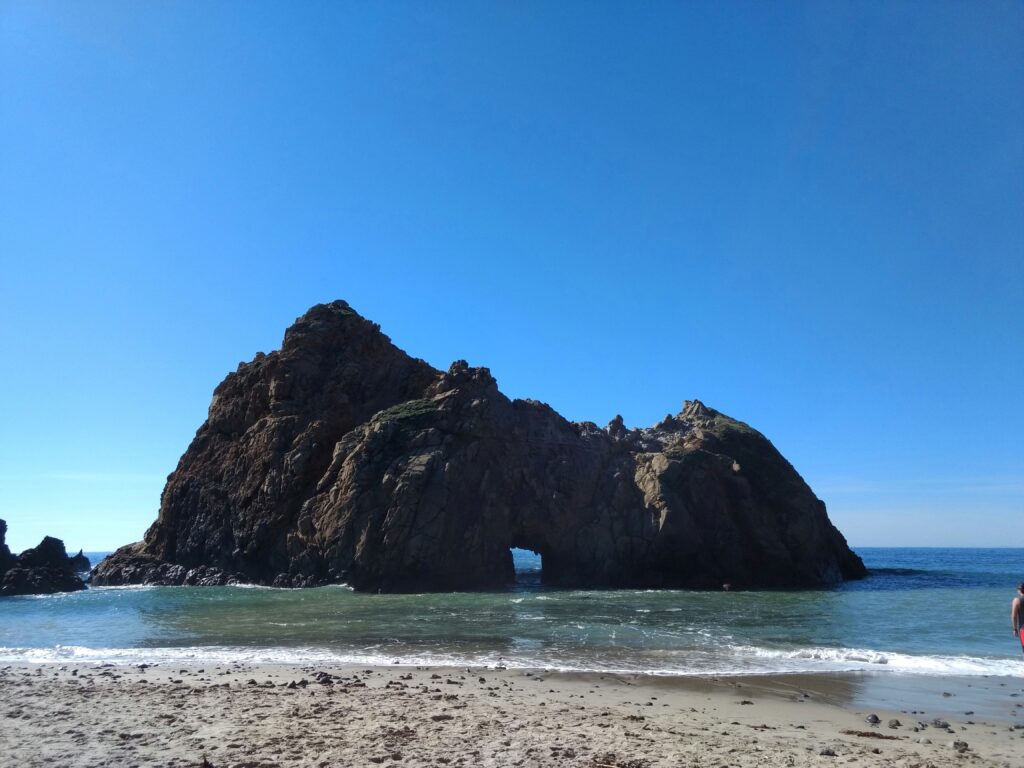 The striking rock of Pfeiffer Big Sur is located near the sandy beach along the California coastal campgrounds.