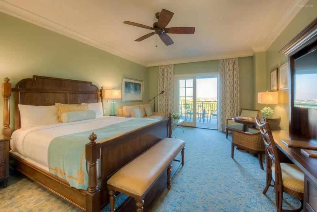 Classic coastal king bedroom with balcony at destin FL space.