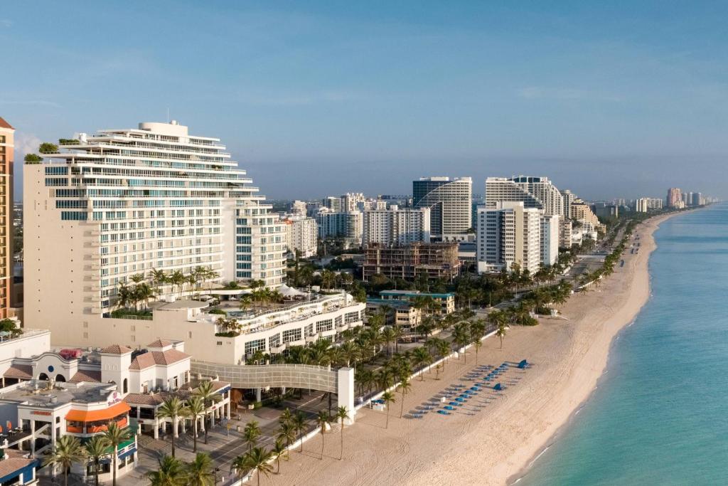 Elevated oceanfront pool deck and skywalk for Florida vacation packages.