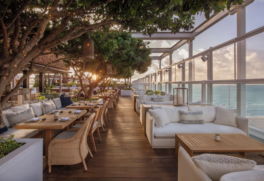 Open-air coastal dining terrace at top Florida beach resorts.