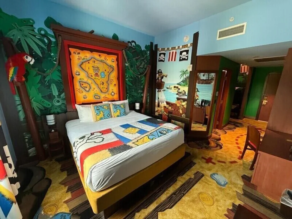 Pirate themed bedroom with treasure map decor for florida kids inclusive stays.