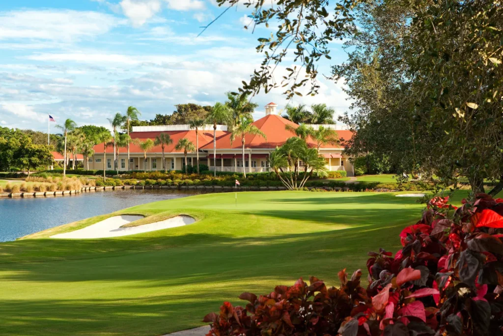 Scenic golf course clubhouse by the lake at Florida beach resorts.