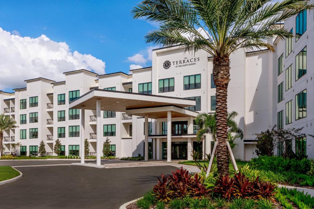 Terraces building entrance with palm trees for orlando vacation packages.