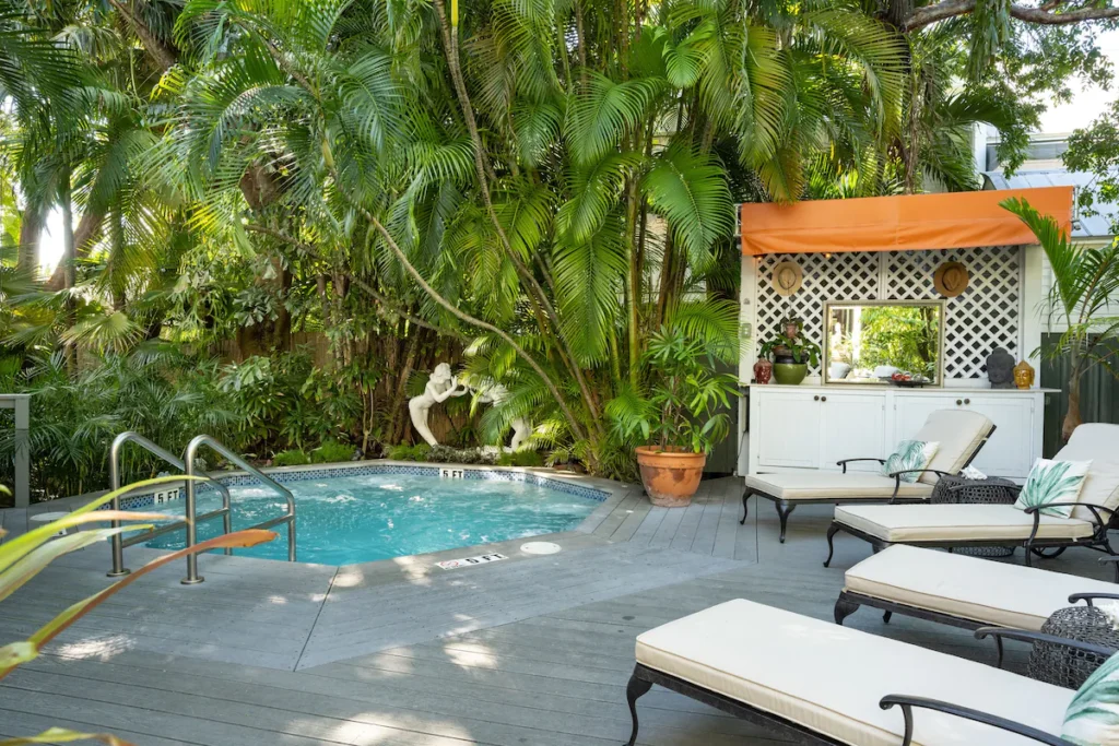 Secluded courtyard pool surrounded by greenery at adult Florida inns.