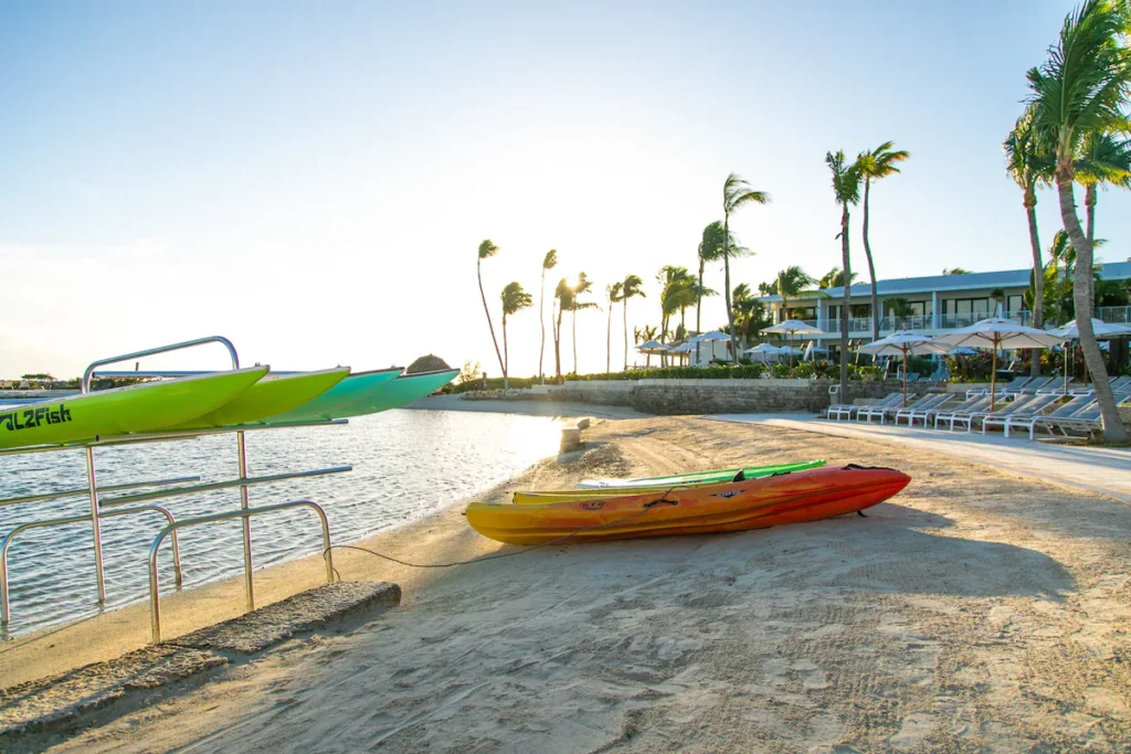 Water sports kayaks along lagoon beach for florida water park packages.