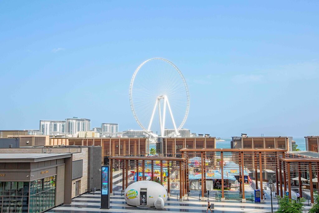 Giant Ain Dubai observation wheel standing high above Bluewaters Island plaza, top places to visit in dubai.