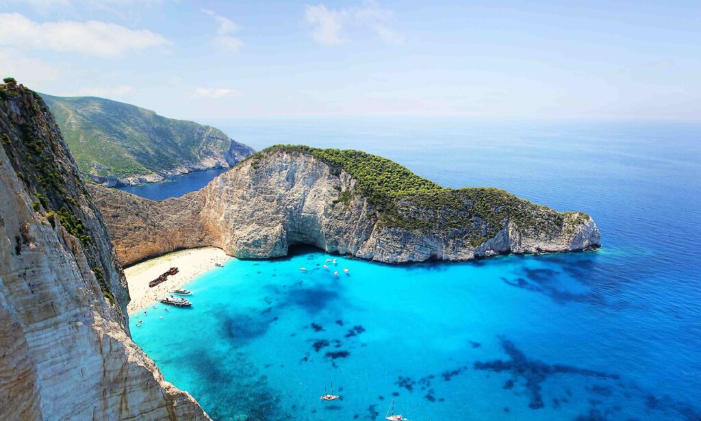 12 Best Greek Islands to Visit (2026): Ranked by Vibe, Budget & Crowds Navagio Beach shipwreck cove demonstrating best Greek islands to visit for travelers.