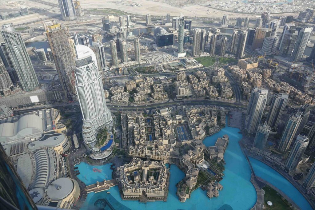 Aerial overview of downtown buildings and lakes surrounding Burj Khalifa, one of the top things to do in dubai.