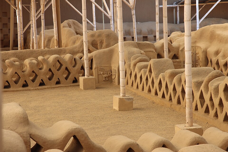 Intricately carved mud-brick adobe walls in ancient Chan Chan city, Trujillo.