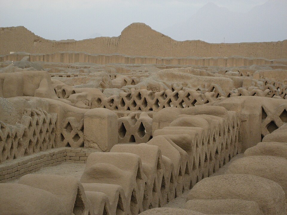 Intricate adobe walls of Chan Chan city, prime Peru attractions beyond machu picchu.