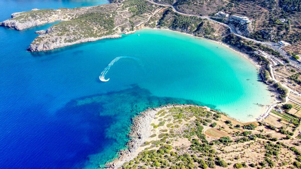 Aerial view of turquoise cove coastline in Crete, one of best Greek islands for couples.
