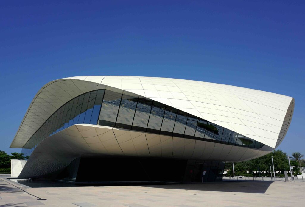 Unique curved white building housing historic exhibits of Etihad Museum, a must see in Dubai for history fans.