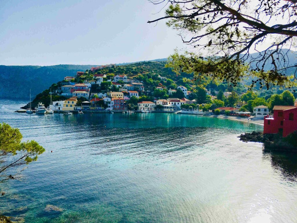 Coastal village of Assos in Kefalonia included in this Greece island hopping guide.