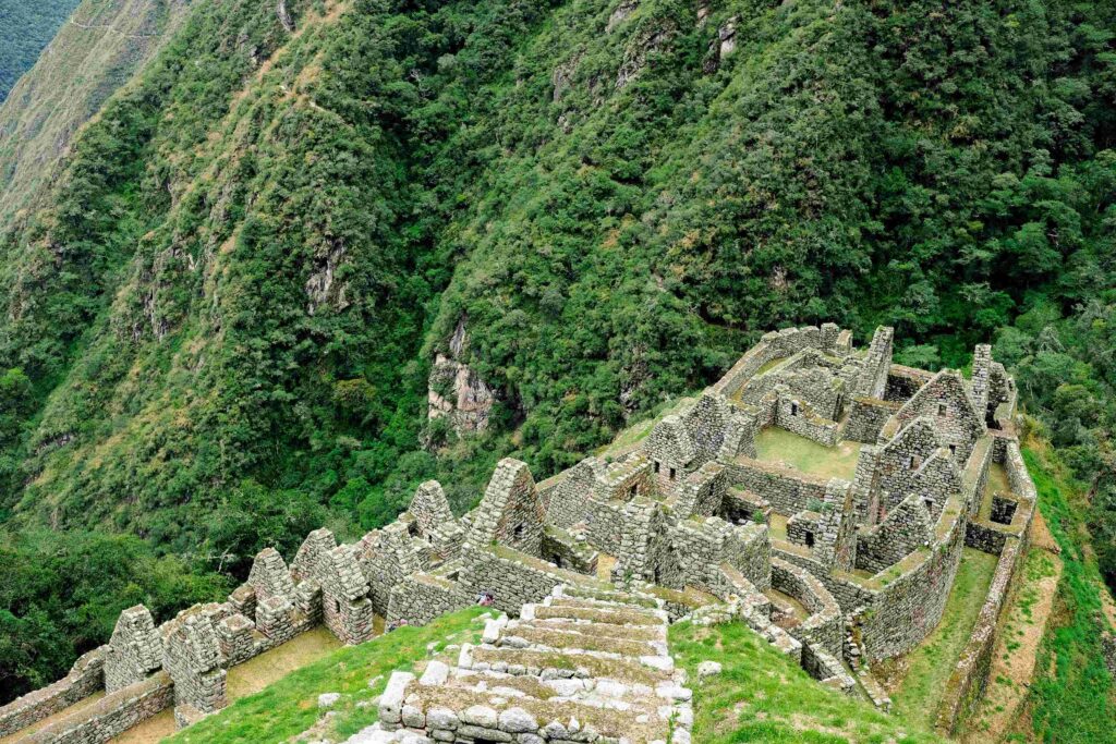 High angle view of clear stone Inca trail structures during the best month to visit Machu Picchu.
