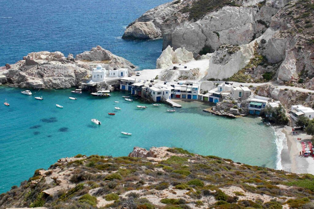 Scenic fishing cove and turquoise water representing top Greece travel locations in Cyclades.