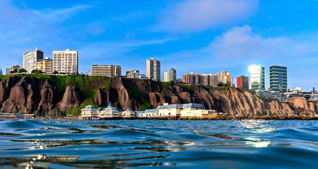 17 Best Things to Do in Lima, Peru (2026): Food, Ruins & Coast Aerial view of city buildings and water of coastal, top things to do in Lima, Peru.