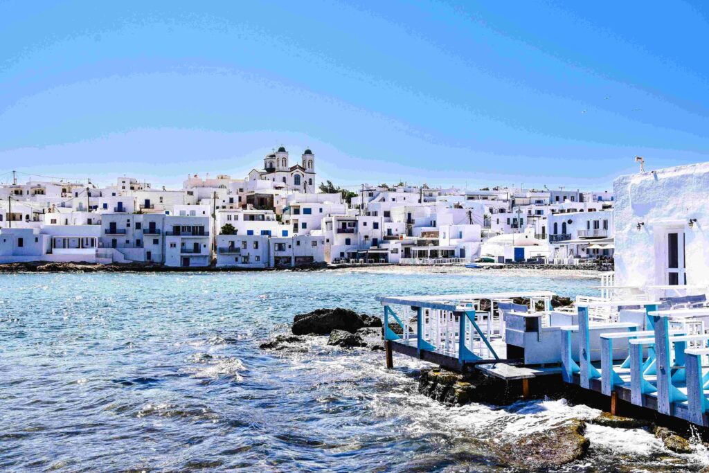 Picturesque Naoussa harbor pier in Paros, one of the best Greece vacation islands.