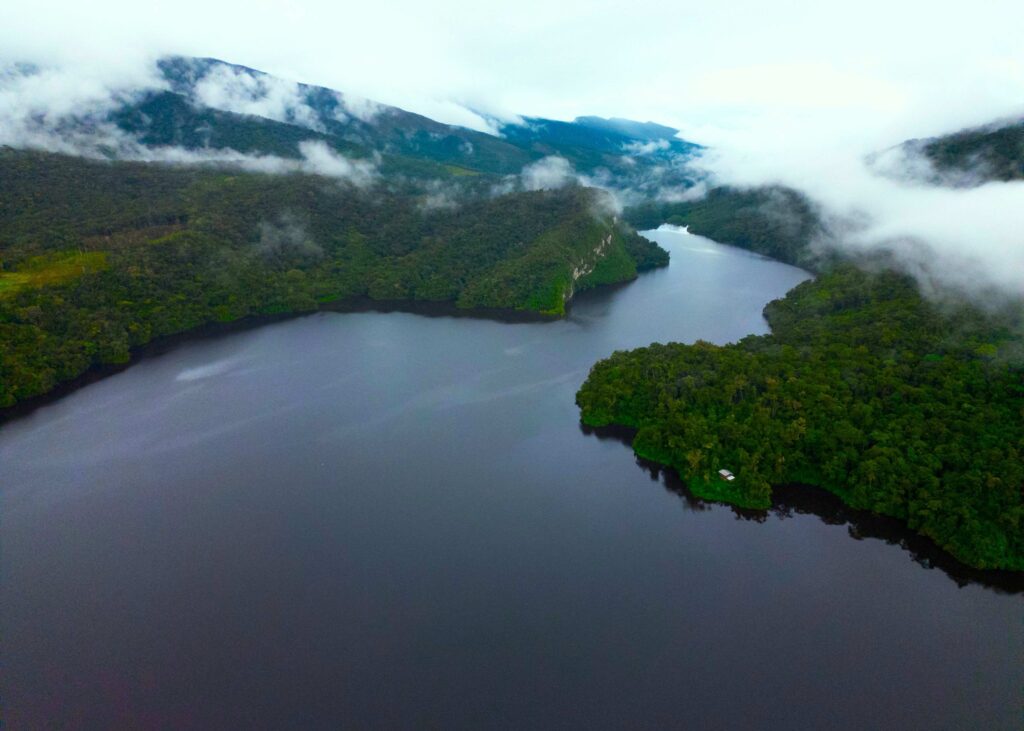 Aerial view of winding Amazon river and dense jungle, top reasons to visit Peru.