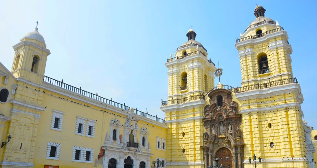 Yellow baroque facade of San Francisco Monastery, a top must see in Lima.