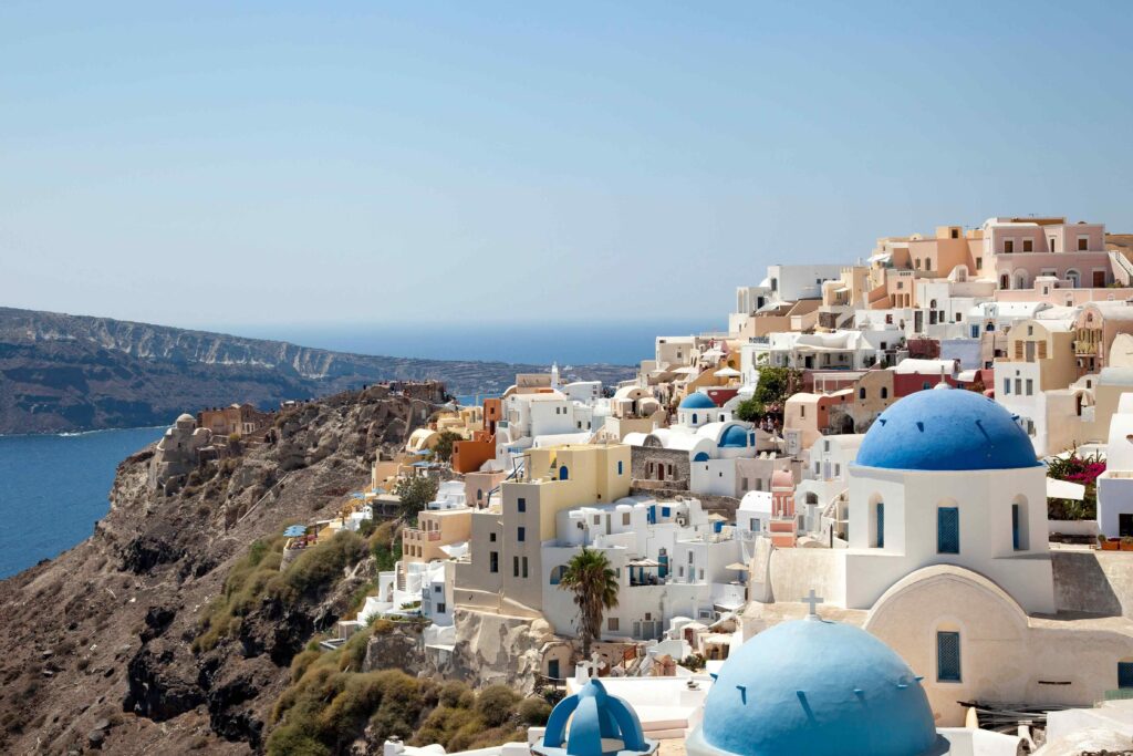 Cliffside whitewashed village over the Aegean Sea, one of the most famous Greek destinations.