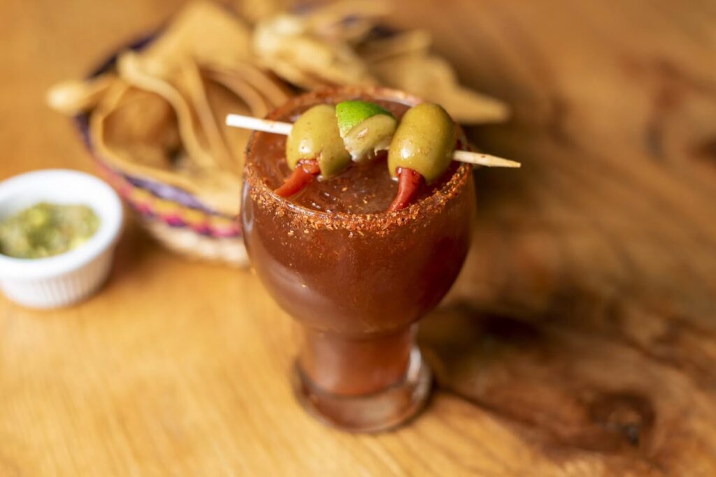 The Best Bloody Mary in Las Vegas (2026): Where to Find Them A classic Bloody Mary cocktail in a short glass garnished with stuffed olives. Source: Unsplash