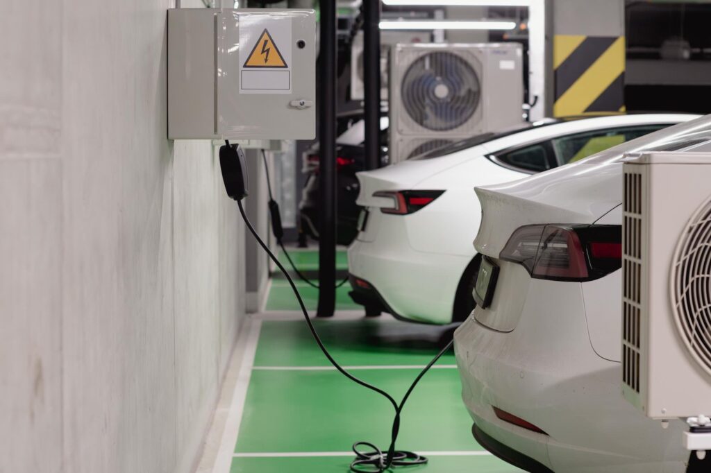 EV charging stations in a parking garage. - Source: Pexels