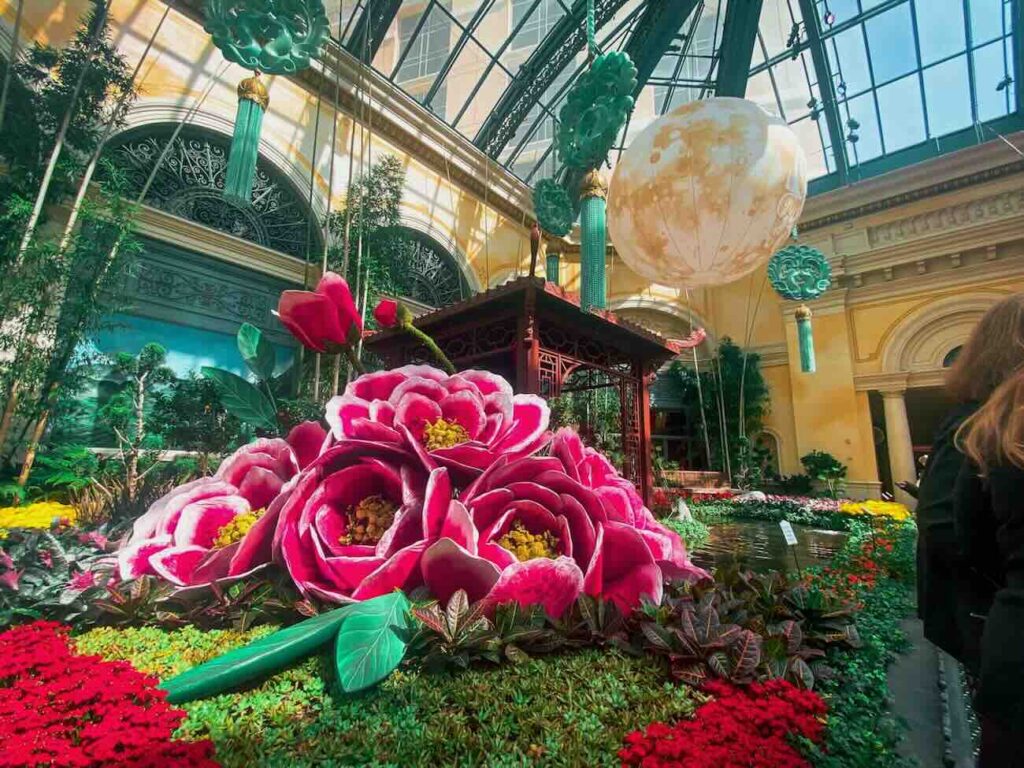 Giant pink flower sculptures inside the Bellagio Conservatory and Botanical Gardens. - Source: Unsplash